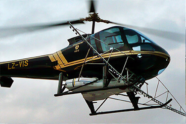 Rapiti Aviation Enstrom helicopter spraying crops.